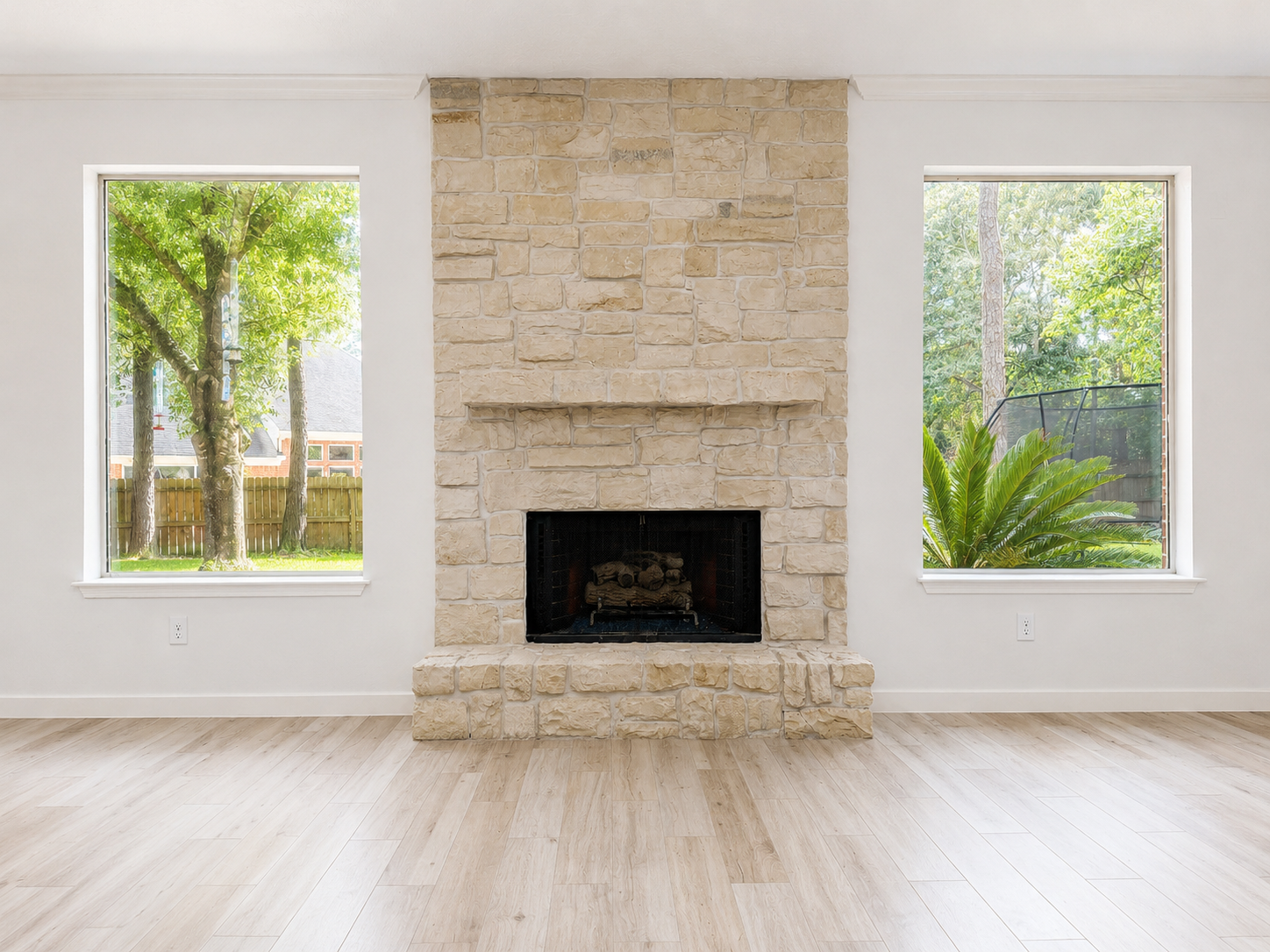 A welcoming perspective highlights the statement fireplace, elegant chandelier, and generous entertaining space. A welcoming perspective highlights the statement fireplace, elegant chandelier, and generous entertaining space.